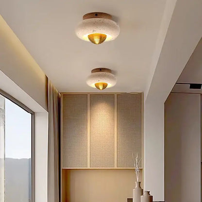 Modern travertine and walnut led ceiling light with textured white concrete disc, gold diffuser, and wooden base for living room decorbites led ceiling