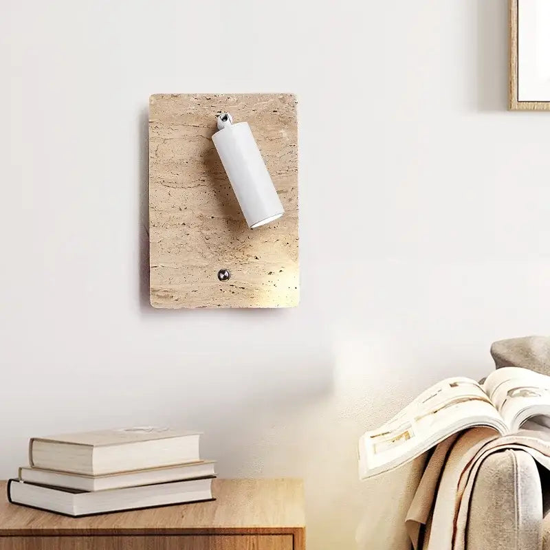 Modern travertine and white led wall light bedroom reading lamp mounted on textured beige cork board decorbites led wall