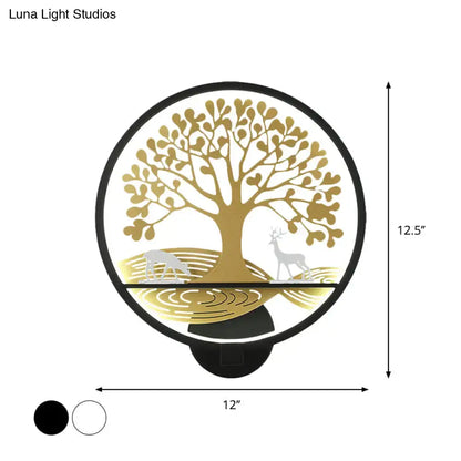 Modern wall lamp featuring a gold tree of life design with deer silhouettes and black trim for bedroom mural lighting