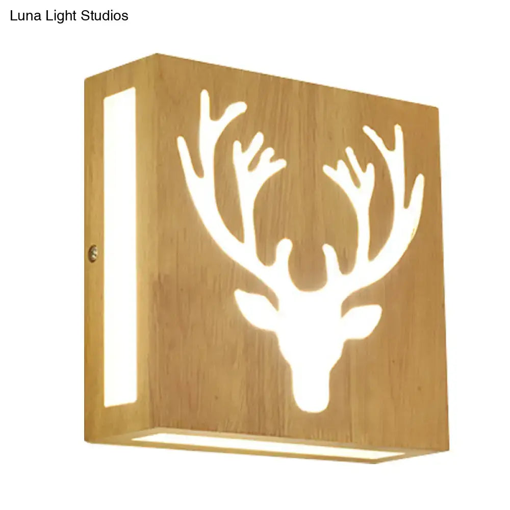 Warm-toned bamboo wall light with deer antler cutout silhouette glowing softly direct wired electric maximum bulb wattage