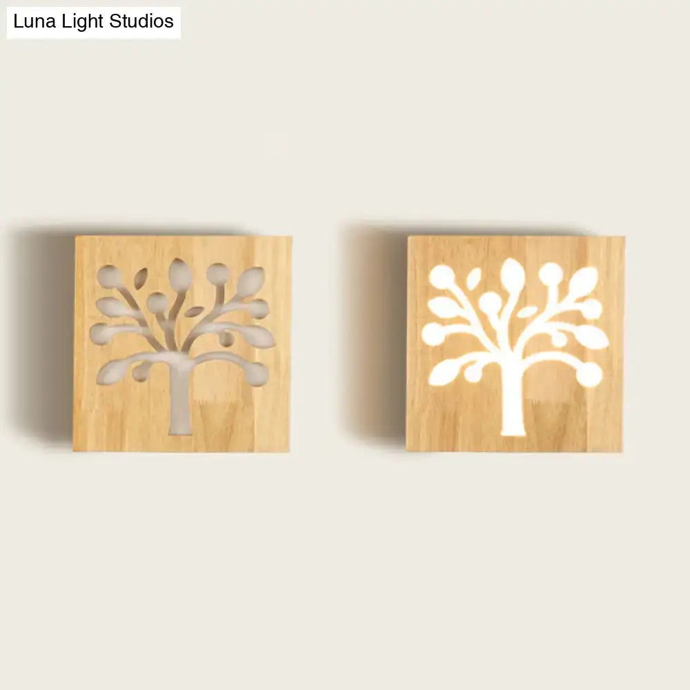 Two square wooden wall sconces with tree silhouette cut-out design for modern square flush mount corridor lighting