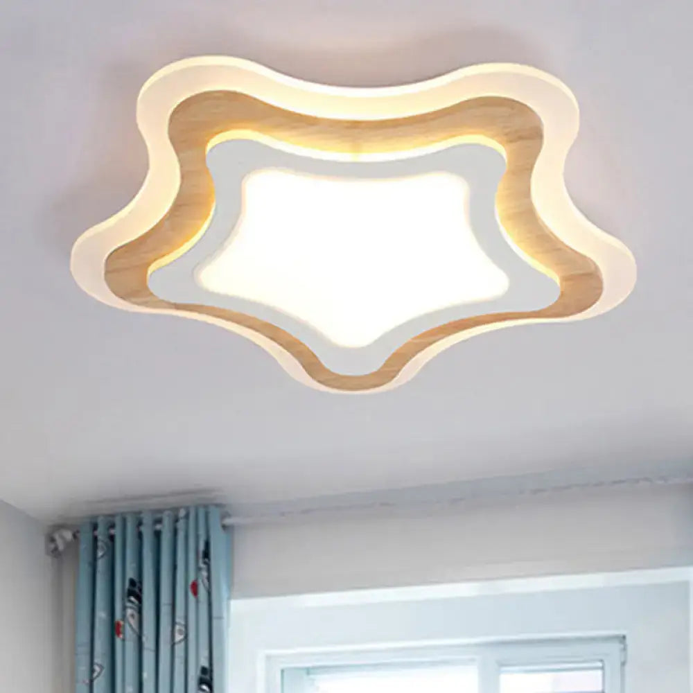 Modern star-shaped flush ceiling light with warm glow featuring layered wooden and white acrylic panels for kids room decor