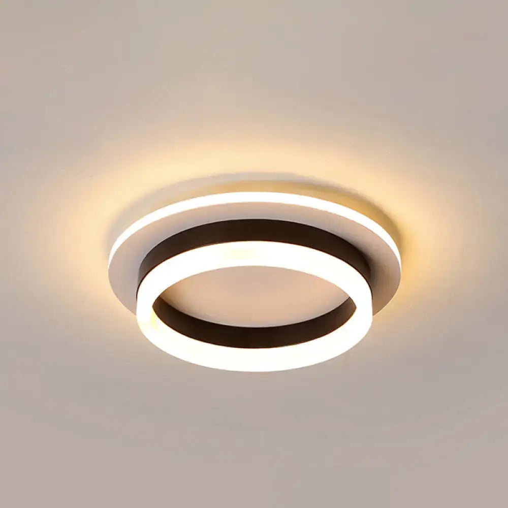 Modern circular decorbites™ led flush mount ceiling light with concentric rings and warm acrylic diffuser glow