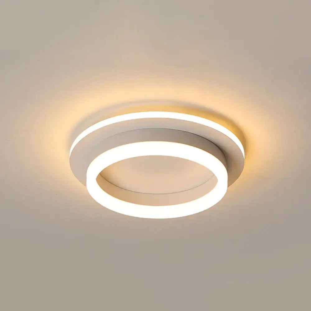 DecorBites™ compact metal led flush mount ceiling light with acrylic diffuser and modern white circular design emitting warm glow