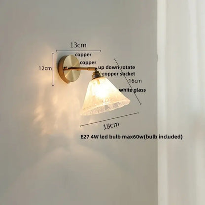 Copper-finished wall sconce with white textured glass shade complements modern decorbites blue glass wall lighting