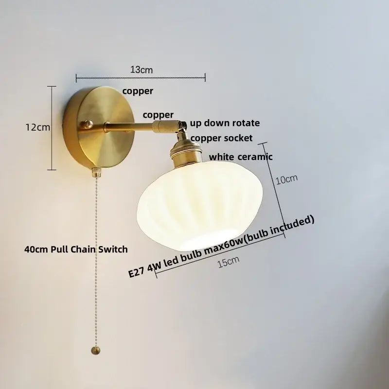 Brass-finished wall sconce with white ceramic shade and copper hardware for decorbites blue glass wall decor