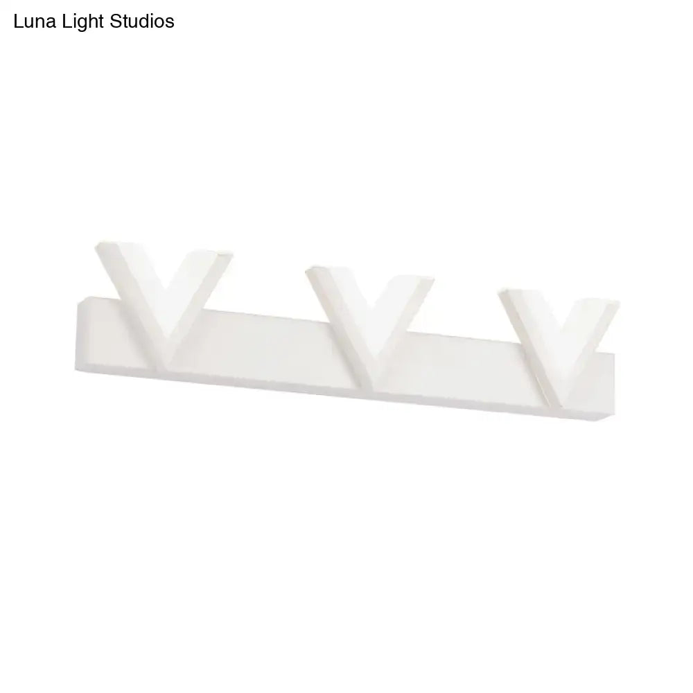 White minimalist wall-mounted coat rack with three v-shaped hooks complementing a modern warm white led vanity light