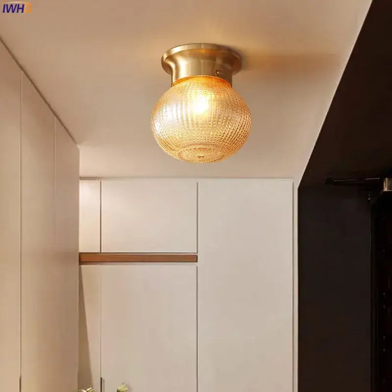 Modern vintage gold glass ball ceiling light with brass finish and textured amber glass shade for bedroom decorbites glass ball