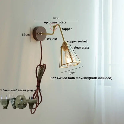 Modern walnut and brass clear glass led wall sconce with copper finish, adjustable arm, and circular base for decorbites clear glass lighting