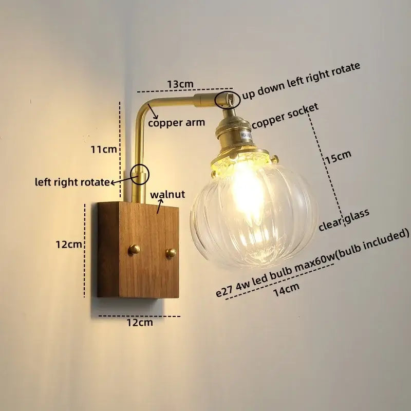 Modern walnut copper wall sconce with clear glass bulb brass finish and walnut wood base for stair lighting