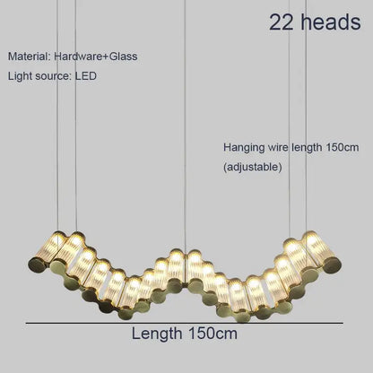 A modern 150cm decorbites golden chandelier with 22 curved glass and brass heads in a wavy design for living rooms