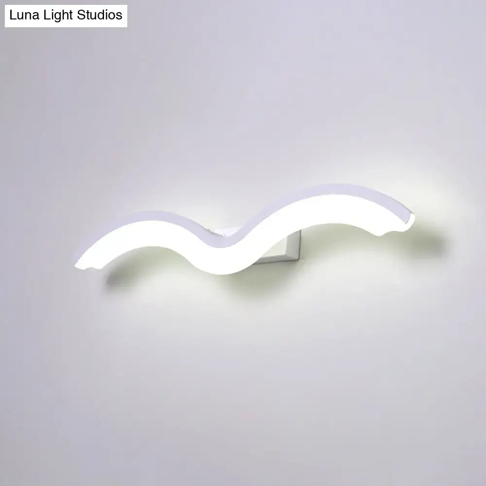 Modern wavelet black and white wall sconce with a sleek wavy design LED light for bathroom use