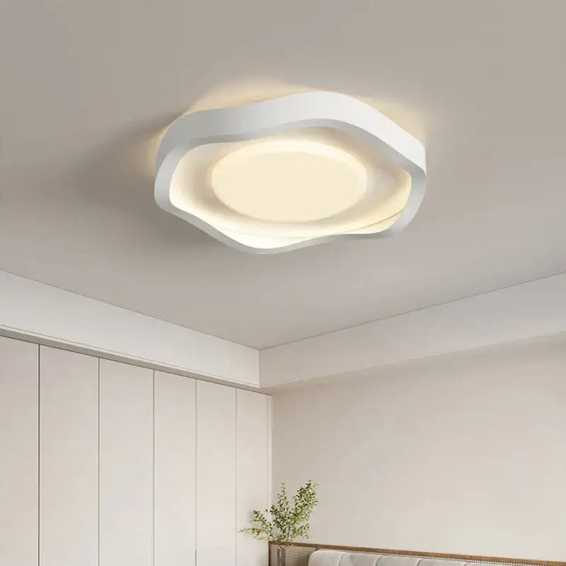 Modern wavy white cream style led ceiling lamp with sleek layered circular design and soft ambient glow for living room decor