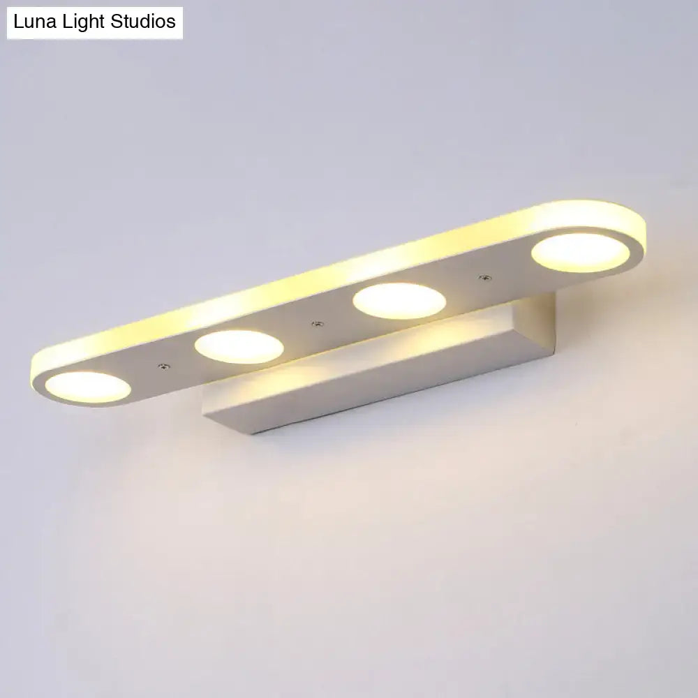 Modern white led vanity wall light with four circular bulbs arranged in a sleek design providing warm white light