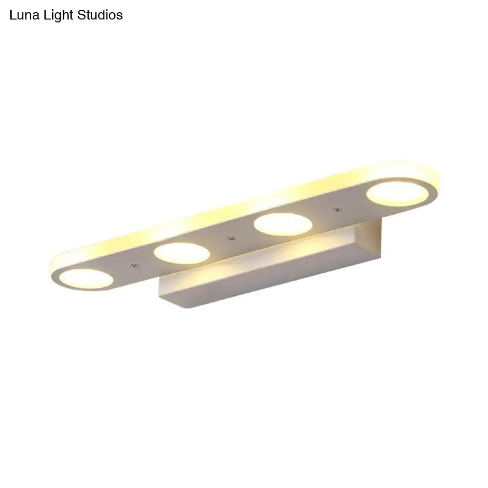 Modern white 3-light led vanity wall light with three circular bulbs providing warm white light for bathroom use
