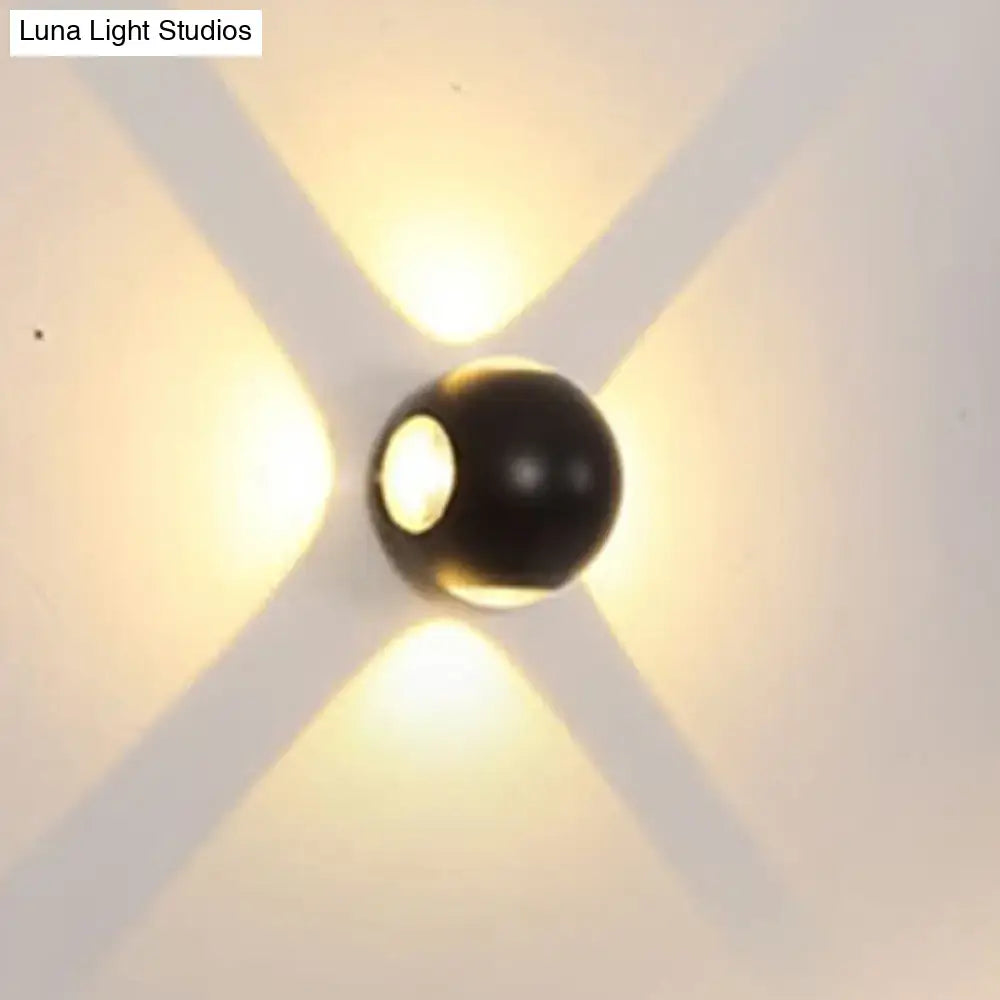 Modern white 4 light dome wall sconce with black spherical design casting warm cross light patterns 110v-120v lamp