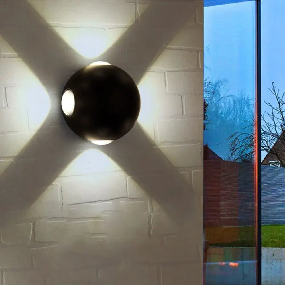 Modern white 4 light dome wall sconce black matte spherical design emitting warm light with x-shaped shadow 110v-120v