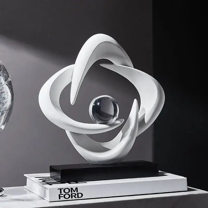 Modern white abstract resin sculpture with flowing curves and a clear glass sphere for living room decorbites decor