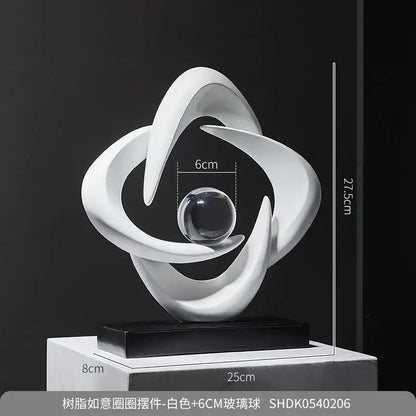 Modern white abstract resin sculpture with flowing curves and central clear glass sphere for living room decorbites abstract resin decor