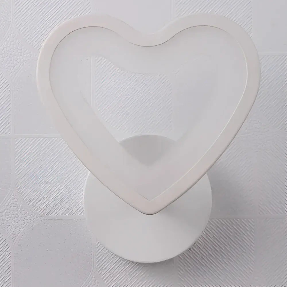 Modern white acrylic led wall sconce in heart shape with smooth glossy finish for childrens bedroom decor by decorbites acrylic led