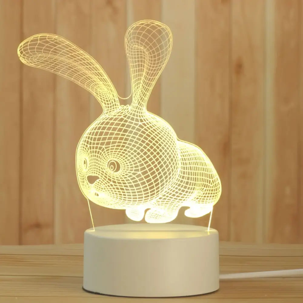 A glowing wireframe rabbit-shaped decorbites 3d acrylic night lamp with a white base for bedroom led decor