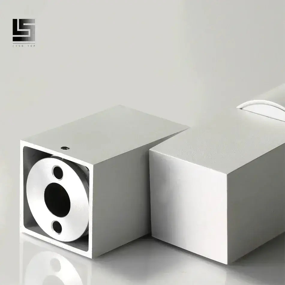 Silver aluminum square housing with circular cutout and holes for modern white adjustable angle downlight fixture