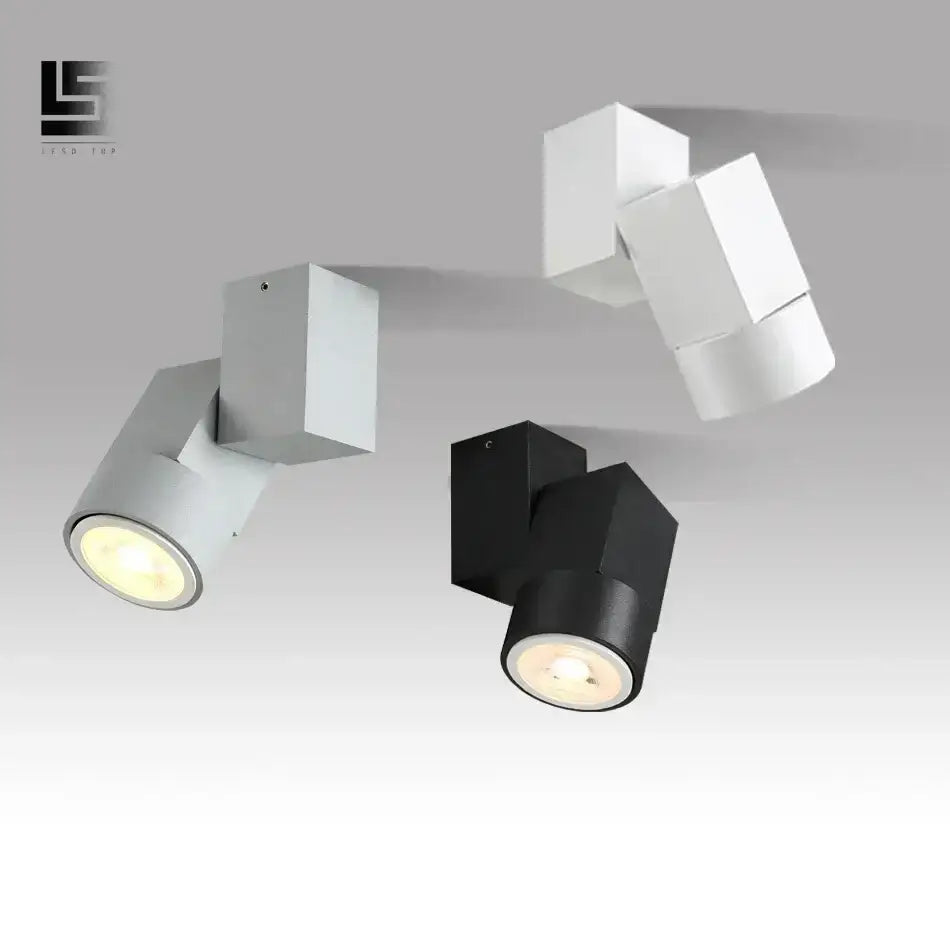 Modern white adjustable angle downlight with sleek black geometric cube fixtures for living room spotlighting