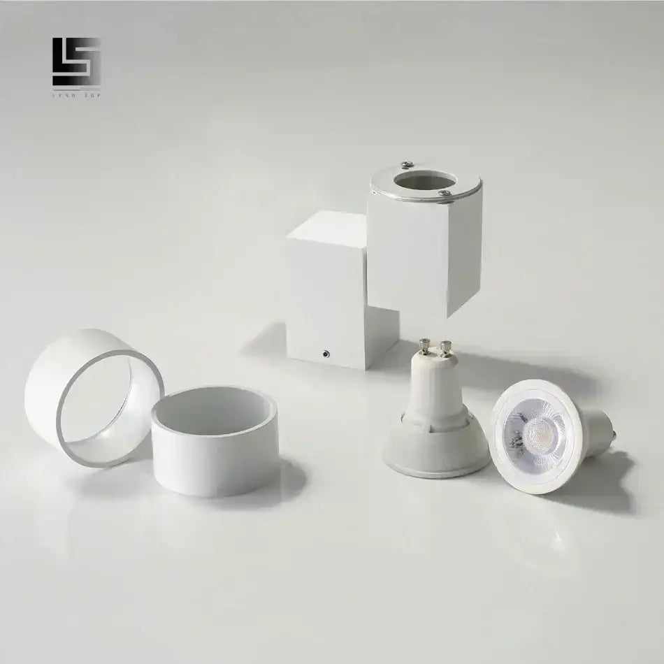 Modern white adjustable angle downlight with sleek design and metallic accents for living room spotlight fixture