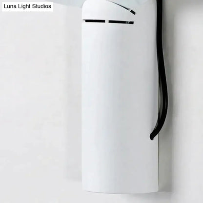 Modern white adjustable wall sconce bedroom reading lamp with sleek cylindrical design and black lid and handle accents