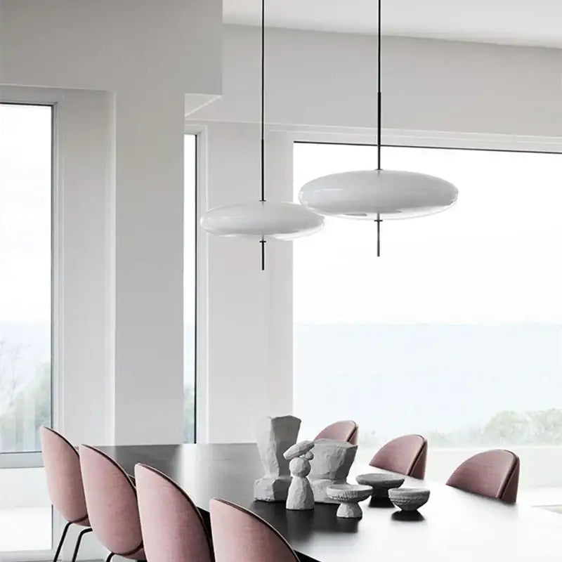 Modern white disc-shaped pendant light with sleek black acrylic cords for kitchen decorbites black acrylic pendant decor