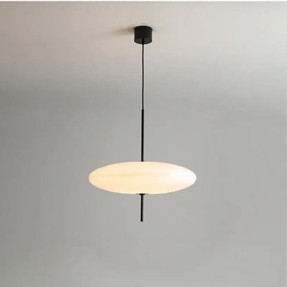 Minimalist black acrylic pendant light with a sleek oval frosted glass shade for modern kitchen decorbites decor
