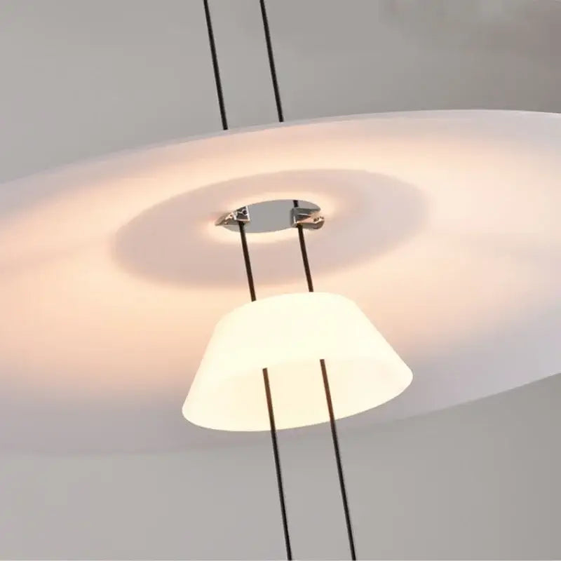 Modern white and black circular pendant light with frosted disc and conical shades by decorbites circular pendant