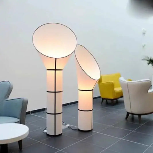 Modern white and black horn floor lamp with geometric accents and soft diffused glow for bedroom decorbites floor lamp