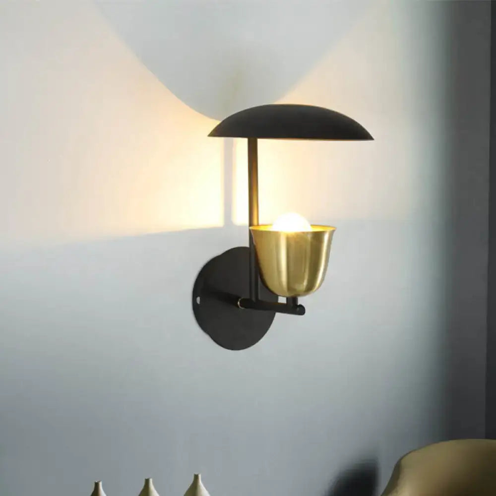 Modern white and brass bell metal sconce wall lamp with matte black base and polished brass bell metal lampshade