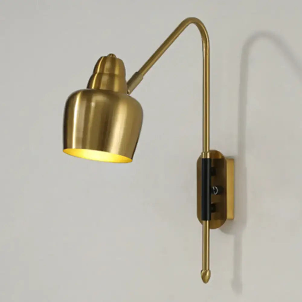 Modern white and brass v-shaped wall light featuring a brass-finished adjustable light type with a sleek curved arm