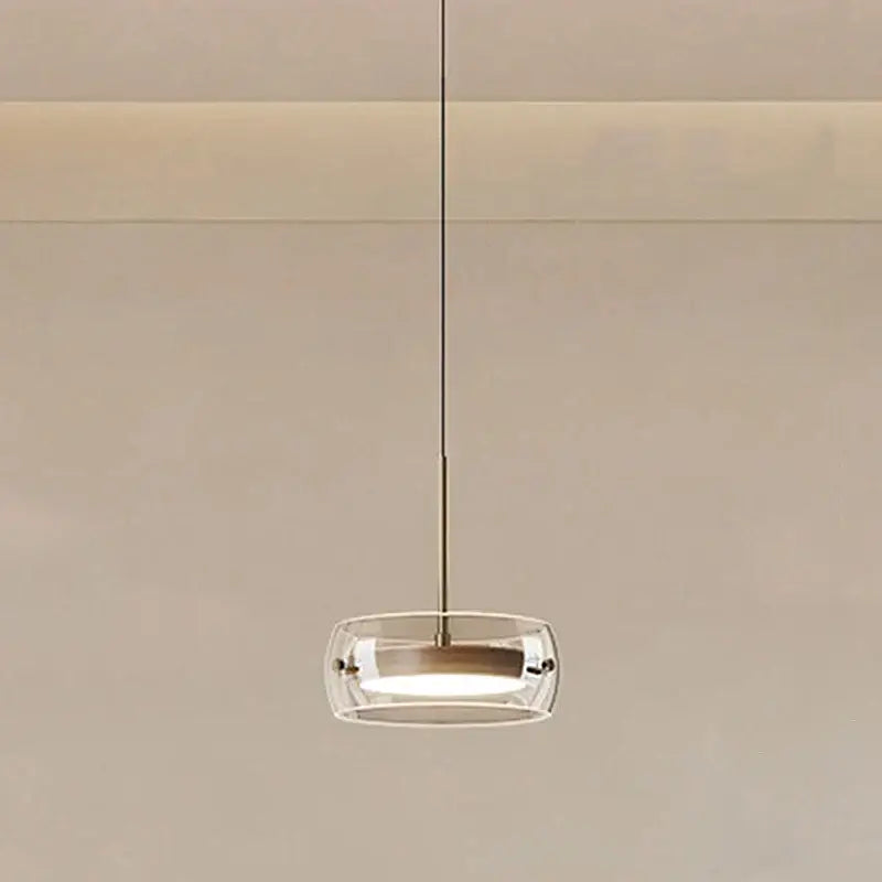 Modern white and clear glass ring pendant light with brushed brass finish and remote dimming for dining room use