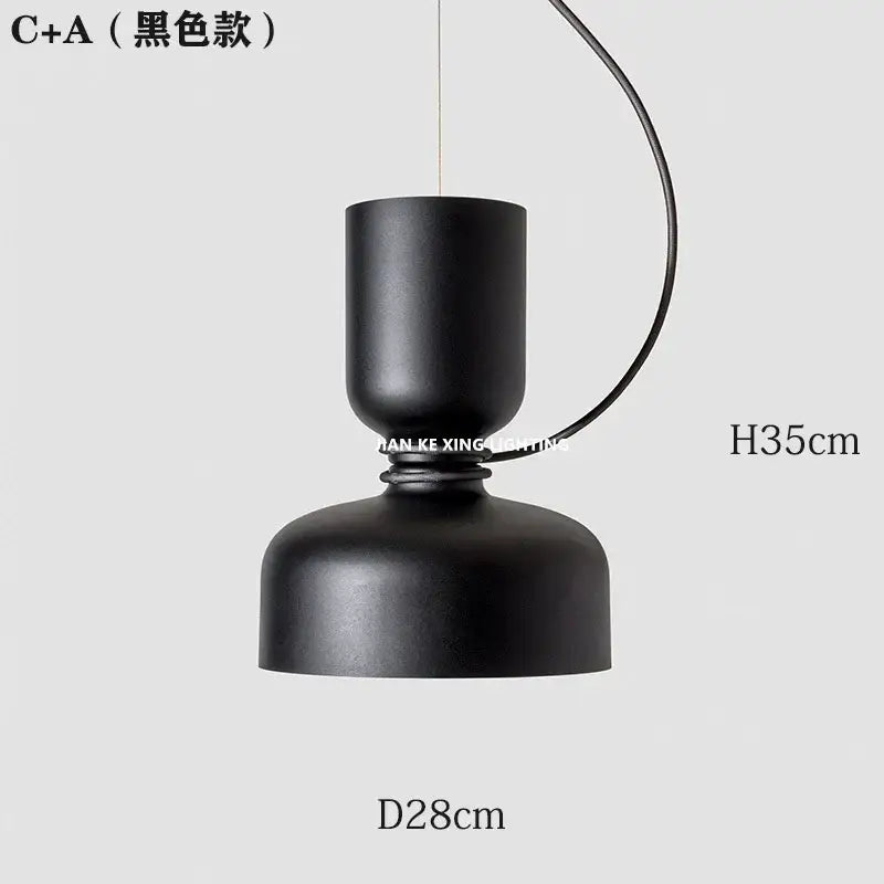 Black matte-finished c+a pendant light with sleek modern design featuring cylindrical top and dome shade by decorbites designer iron chandelier