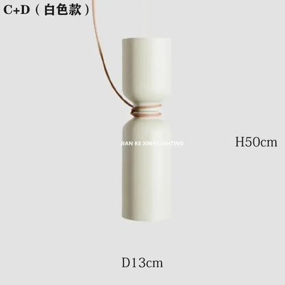 Modern white and copper ceramic pendant light with sleek cylindrical design and thin brown cord for dining room decorbites designer iron chandelier