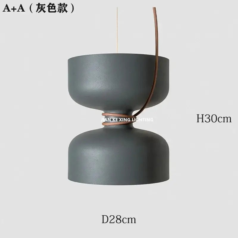 A sleek matte gray a+a pendant light with double-bowl design and leather accent by decorbites designer iron chandelier