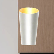 A modern led bedside sconce wall light with a sleek white cylindrical body and warm gold interior lining