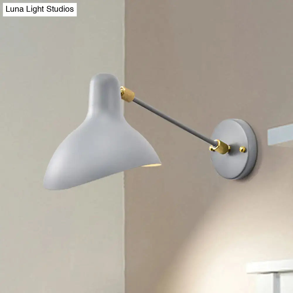 A sleek matte white wall mounted lamp with gray articulated arm and brass joints for living room adjustable light