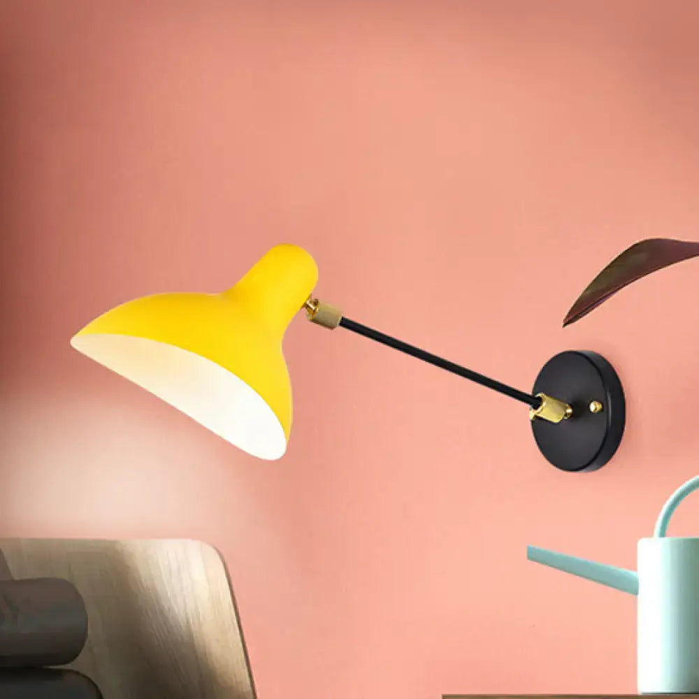 Modern wall mounted lamp in bright yellow with black articulated arm and brass joints for living room adjustable light