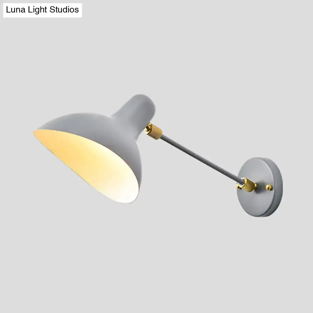 Modern living room wall mounted lamp with gray metal sconce, brass arm, adjustable shade, and warm led light emission