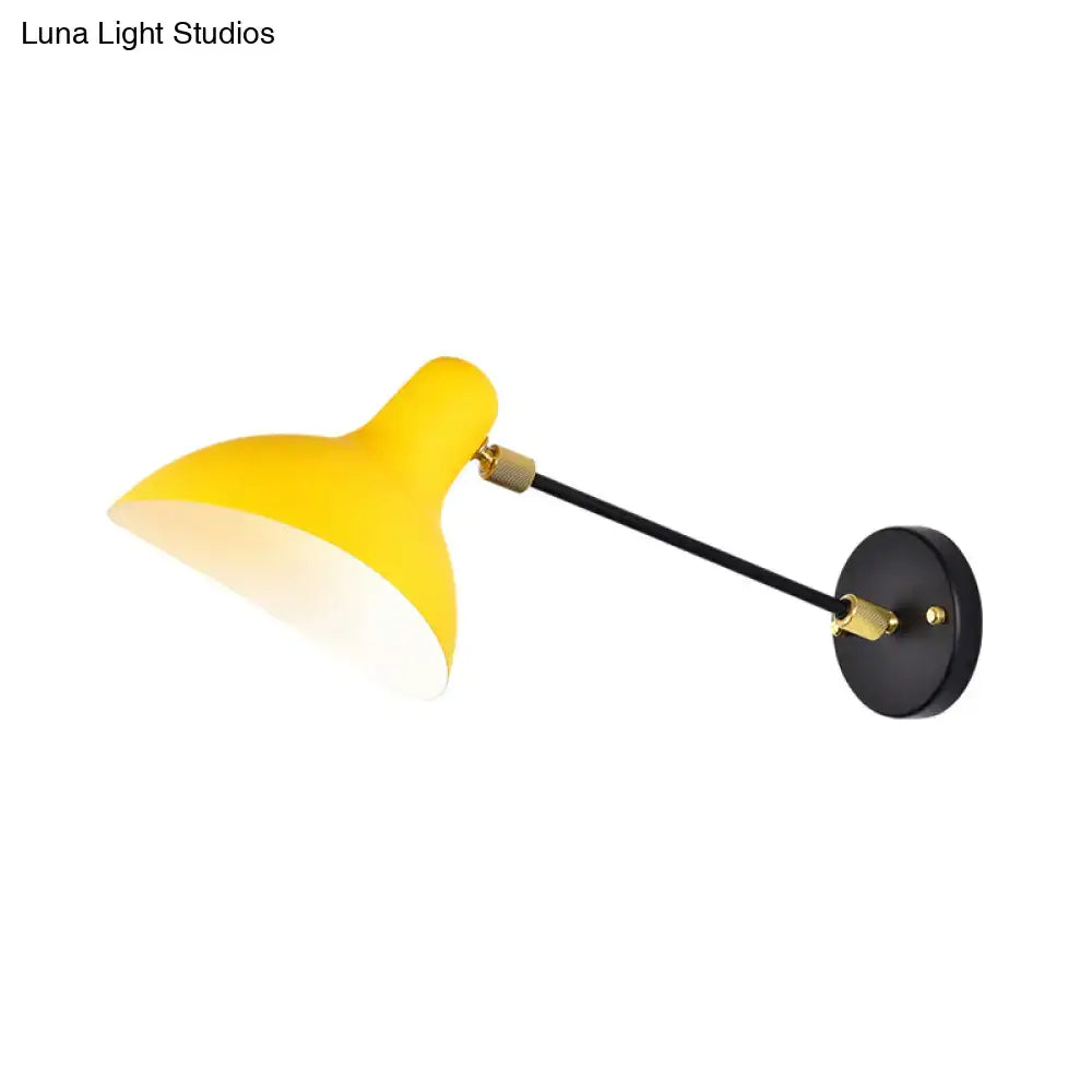 Modern matte yellow wall mounted lamp with black articulated arm and brass accents for living room led lighting