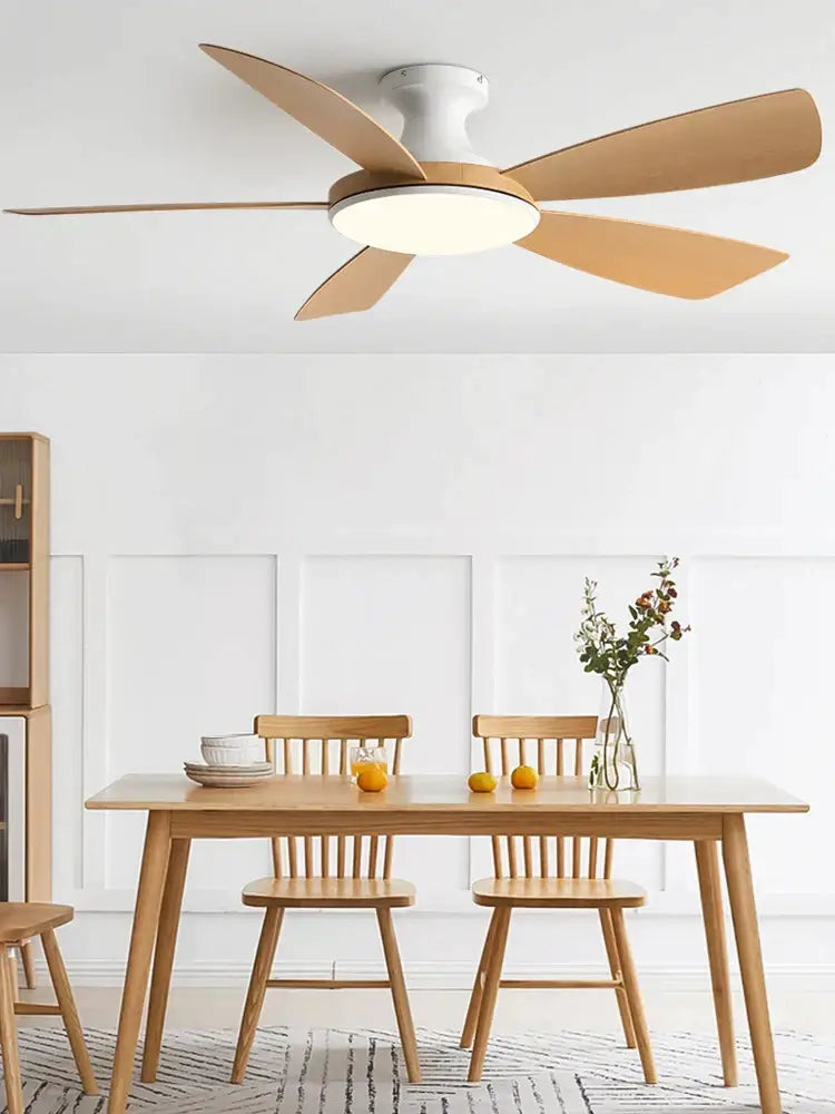 Modern ceiling fan with five light wood blades and white housing featuring integrated led light for bedroom use with remote control