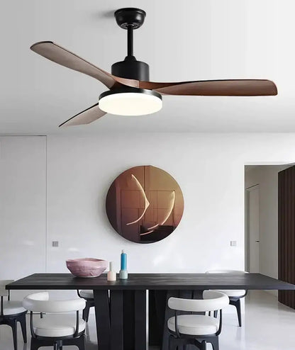 Modern ceiling fan with sleek black housing, rich brown wooden blades, and integrated circular LED light fixture for bedroom