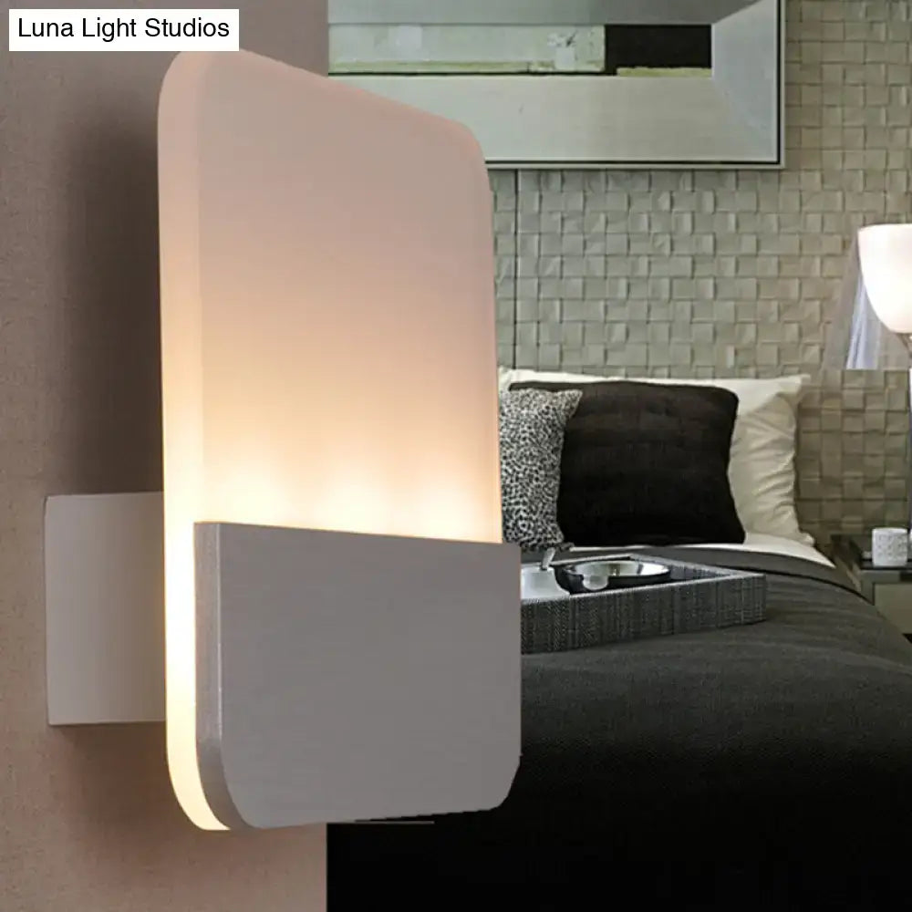 Modern white and silver led sconce light with sleek acrylic design and warm glow for bedroom wall mounting