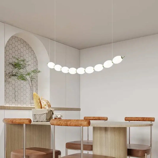 Modern white bead nordic chandelier with spherical bulbs arranged in an elegant curved line for dining room use