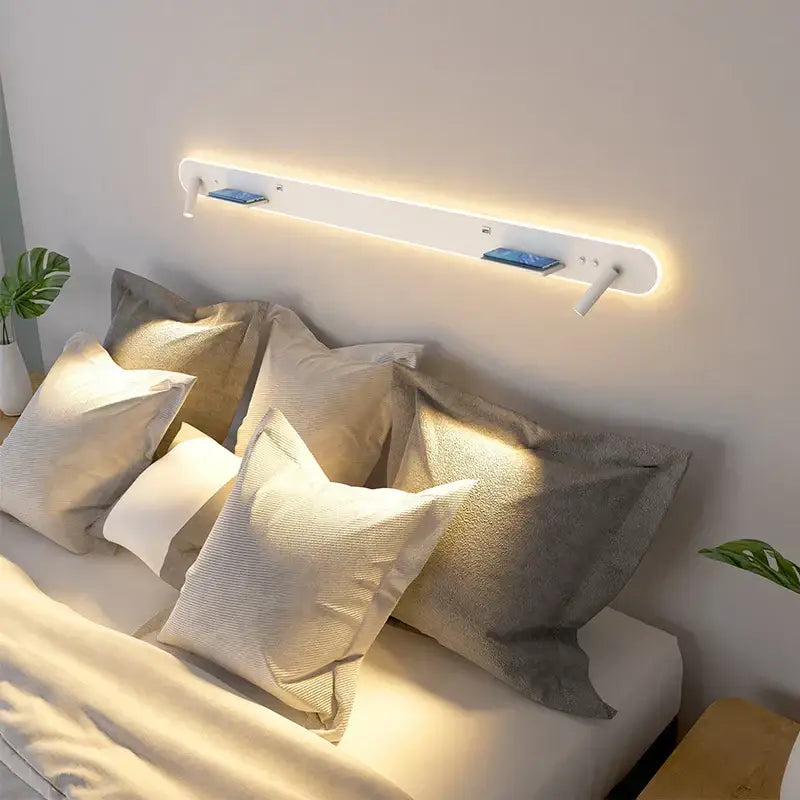 Modern white bedside wall lamp with led reading light and integrated phone charging slots for bedroom use