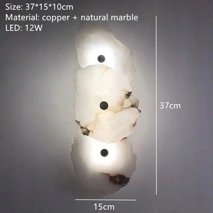 A modern three-tiered brass wall lamp with white and beige stone marble featuring embedded 12w leds for bedroom decor